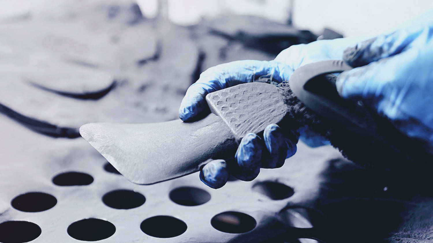 Post-printing remove excess powder, plus initial polishing to smooth the surface of SLS printed insoles